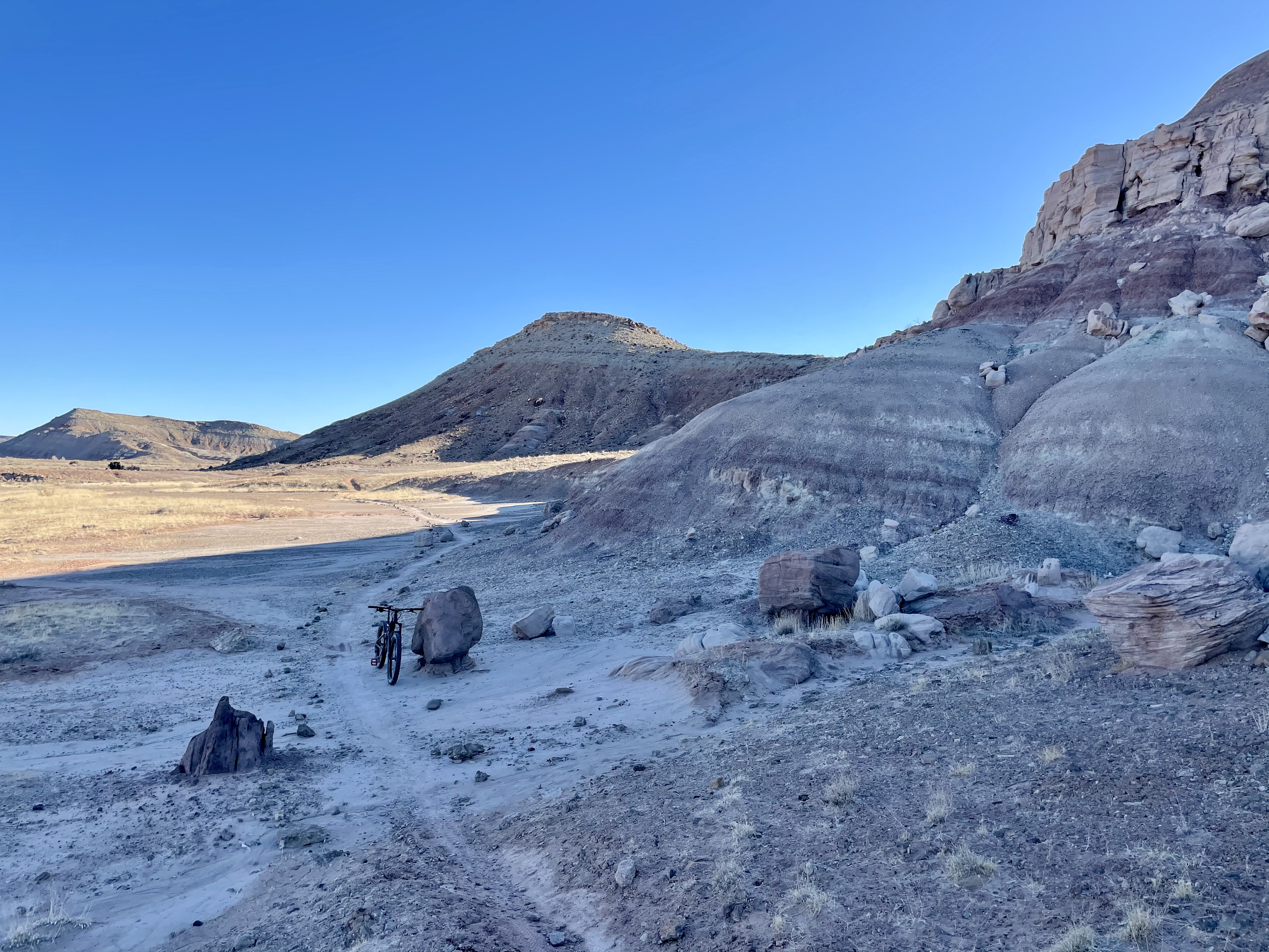 This is the view from Jurassic, the trail that bounds the Klondike Bluffs area from the southwest. It passes the deposits of green rusted rocks and open fields scattered with quartz. 