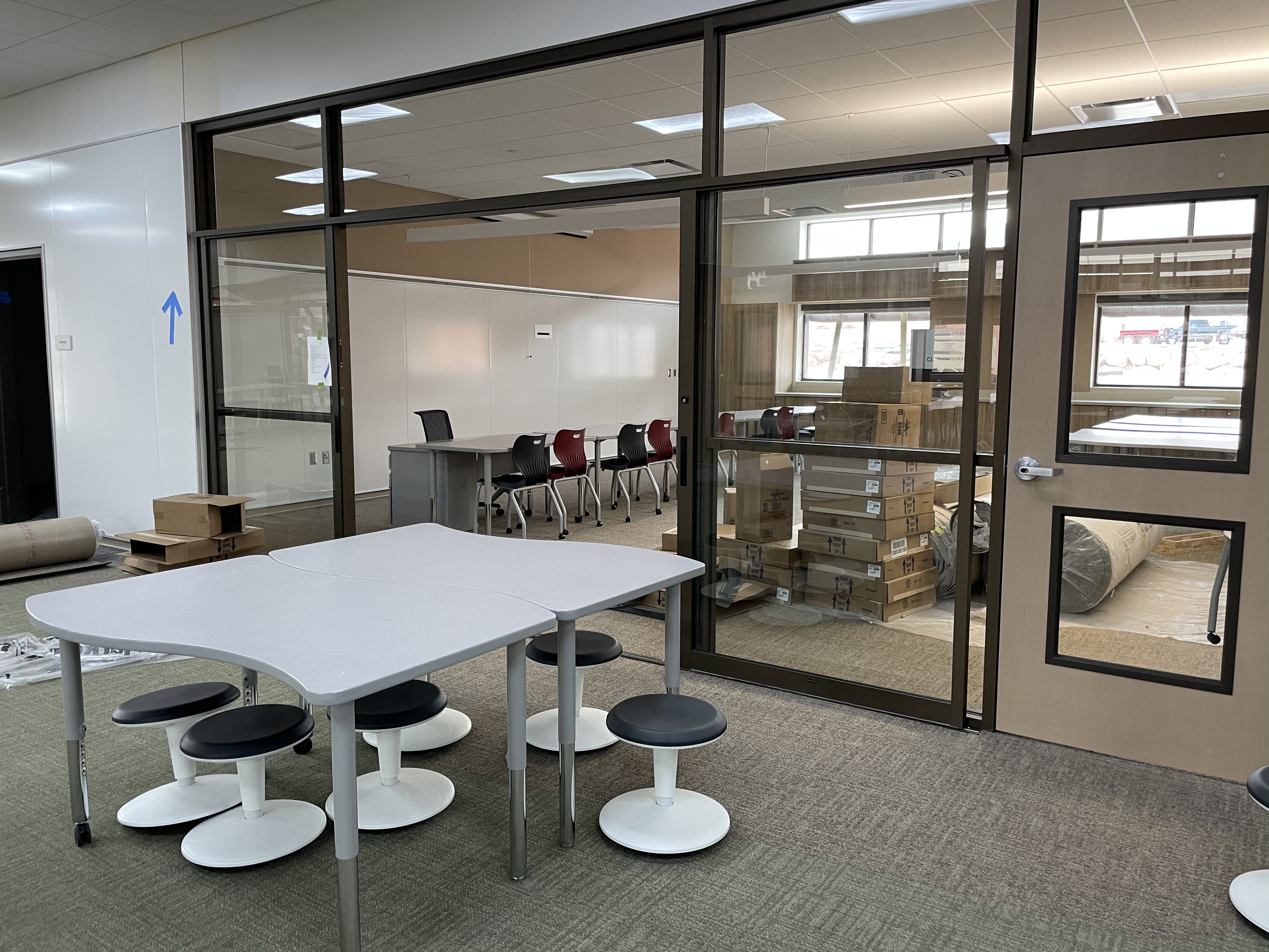 Classrooms inside the Hop are connected to the hallway by sliding glass doors and walls, allowing for teachers to create breakout groups separate from but tethered to the main classroom. 