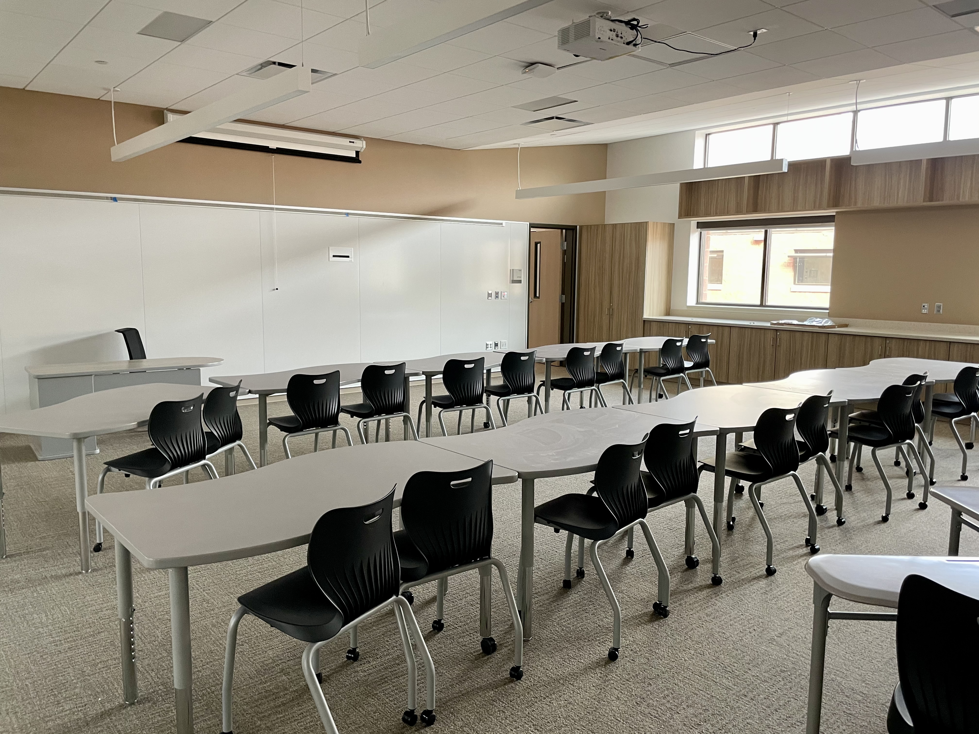 Kay pointed to a theme of motion around the school, with seats, tables, and other furniture all designed to be mobile. One other nice side effect, she pointed out, was that it would prevent students from leaning back in their seats. 