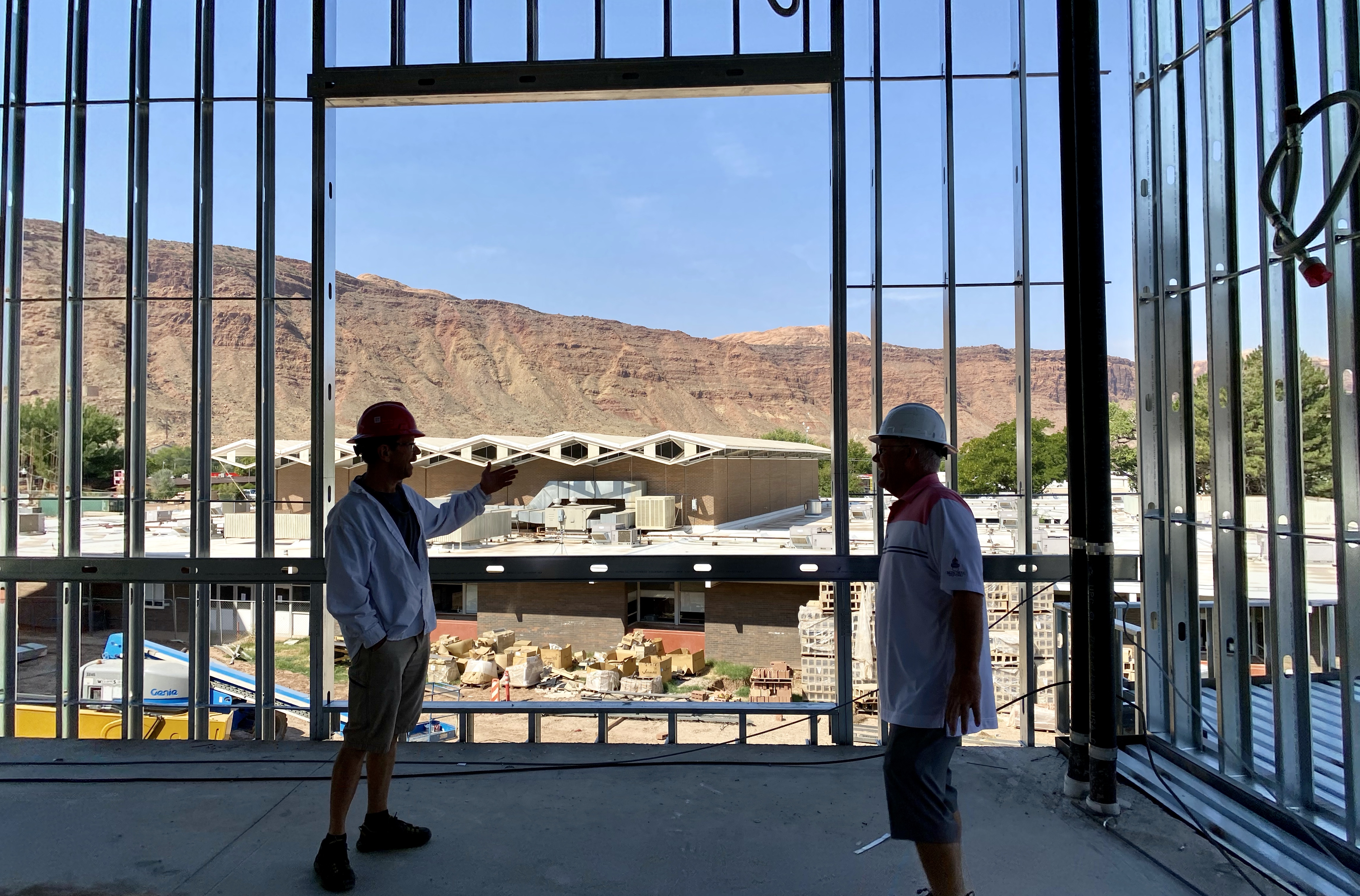 Jim Webster, then-member of the Grand County School District Board of Education, and Grand County Business Administrator Pat Wilson, right, discuss ongoing middle school construction in August, from the same room as Tatton and Kay in the previous photo. 