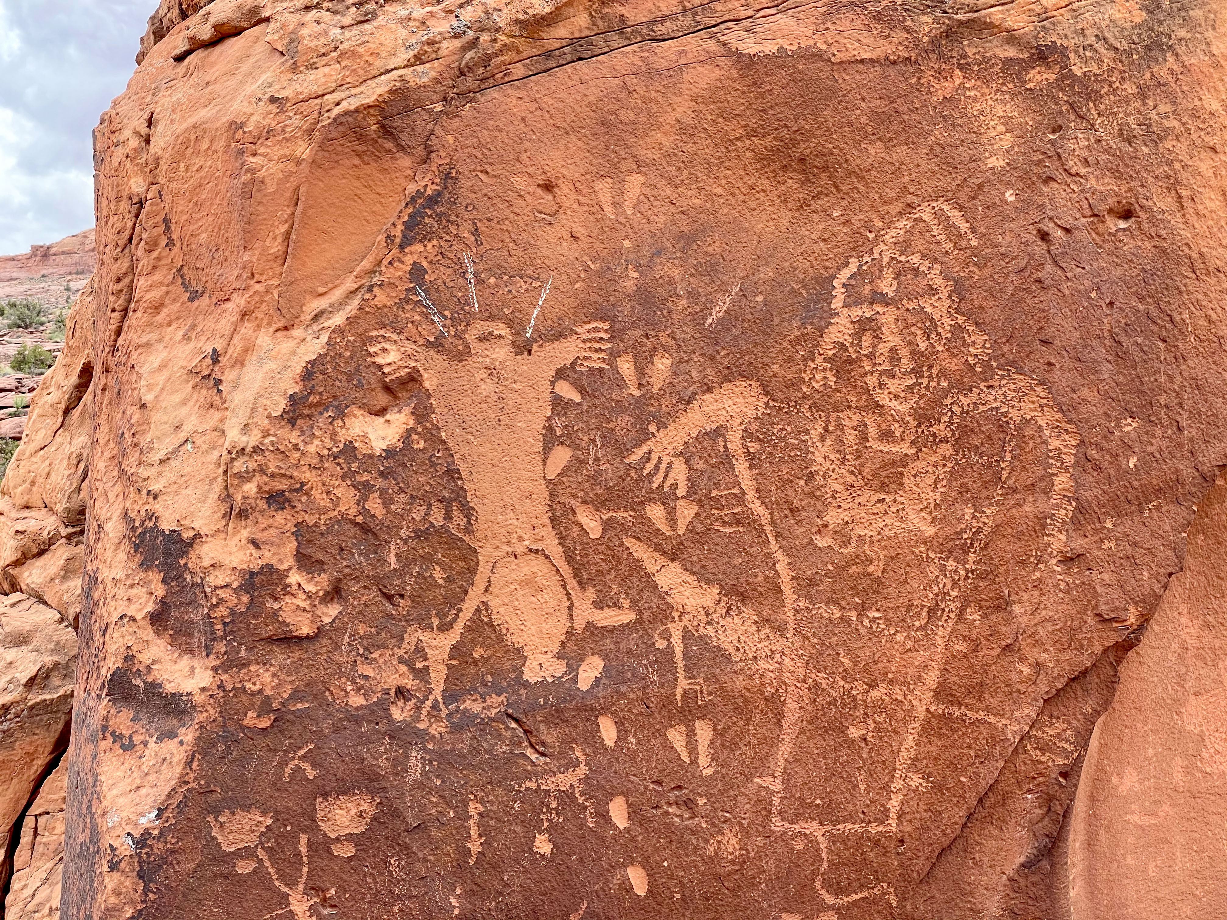 white lines apparently drawn in chalk appear above the head of the birthing figure on Birthing Rock