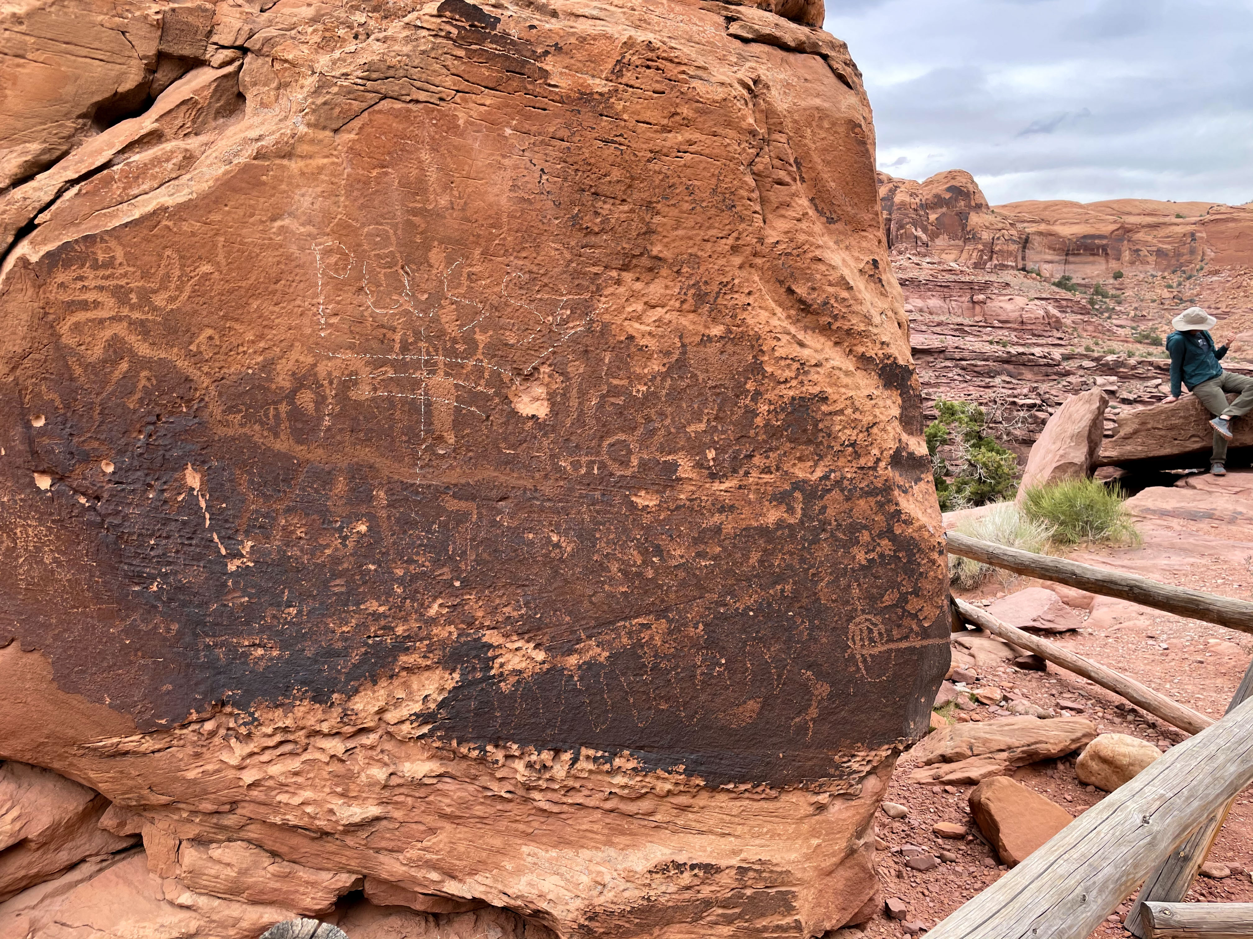 the word "pussy" is drawn apparently in white chalk over one of the panels on Birthing Rock.