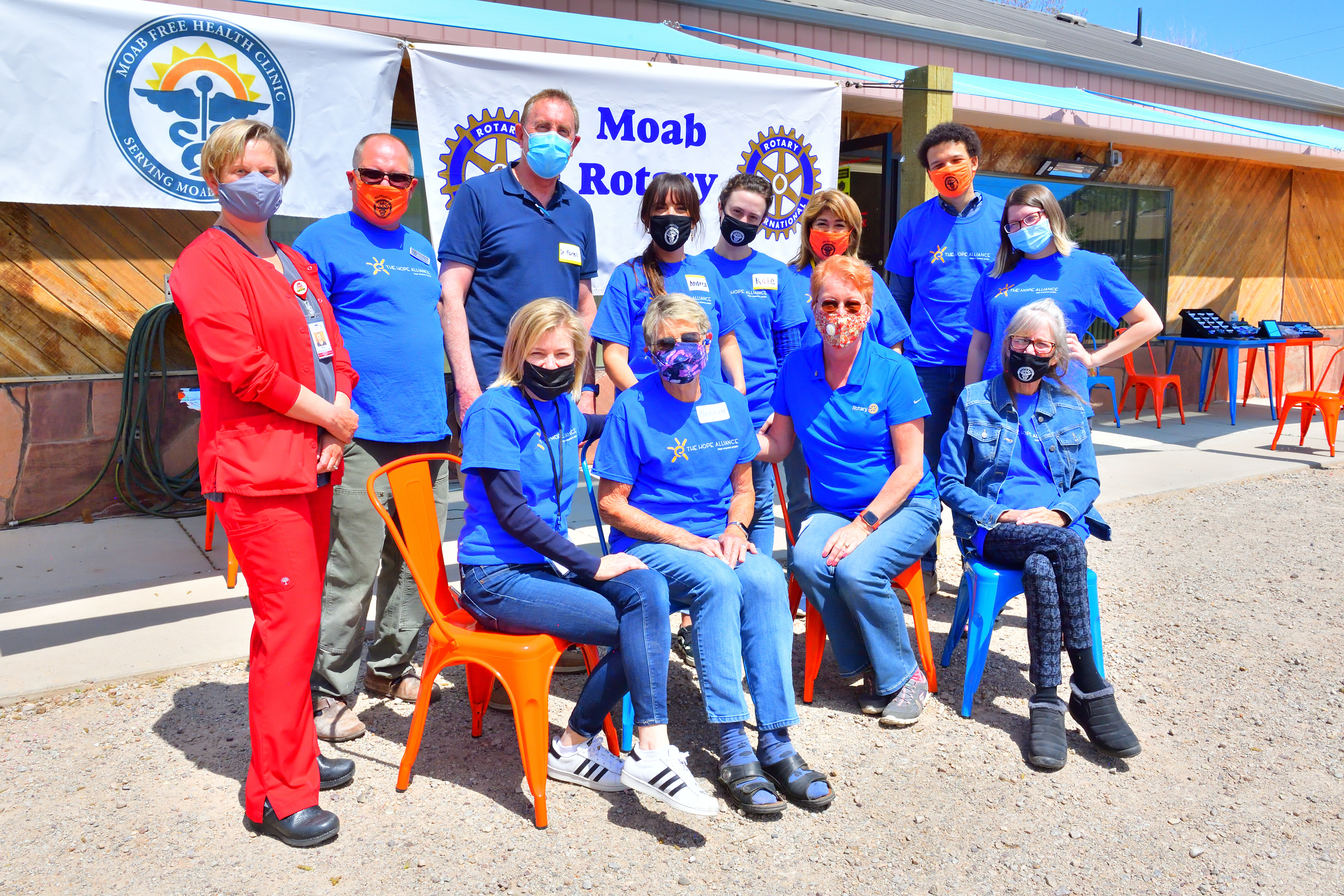 members of the Rotary Club of Moab pose with employees of the Moab Free Health Clinic