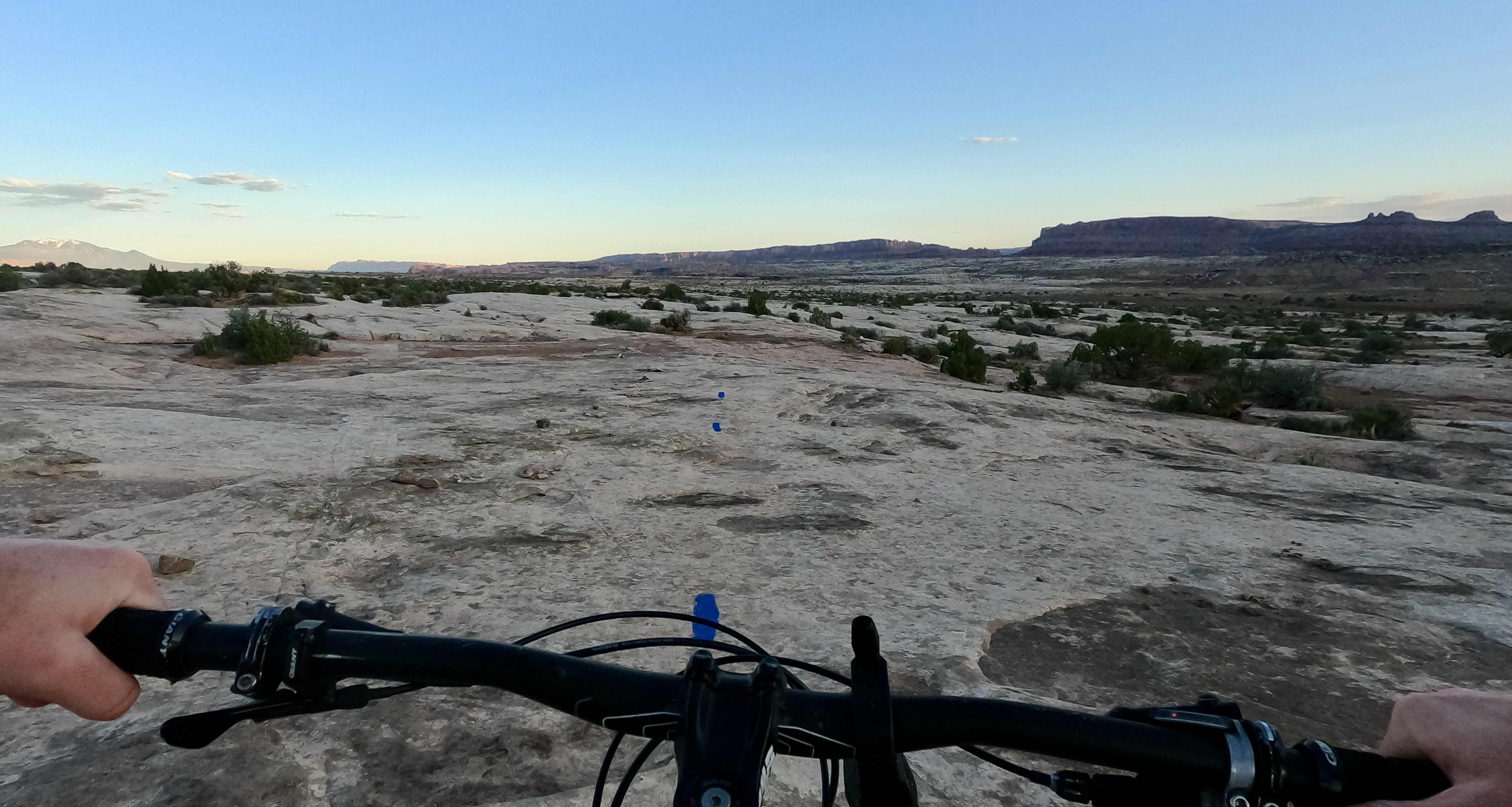 A dotted purple line guides riders over white sandstone on Houdini, a blue square ride in the southern section of Klonzo