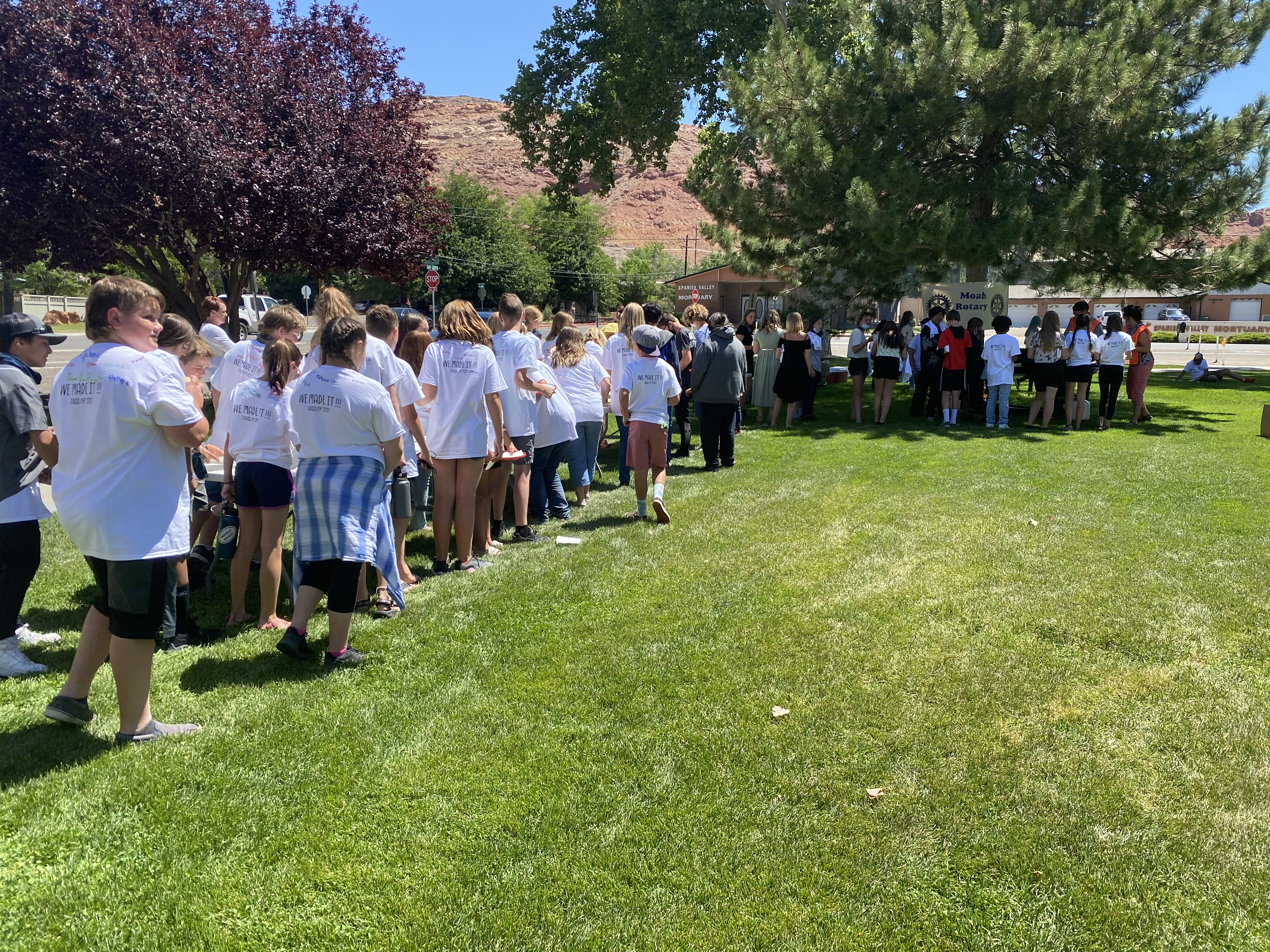Middle schoolers line up for lunch at a barbecue put on by the Moab Rotary Club. 