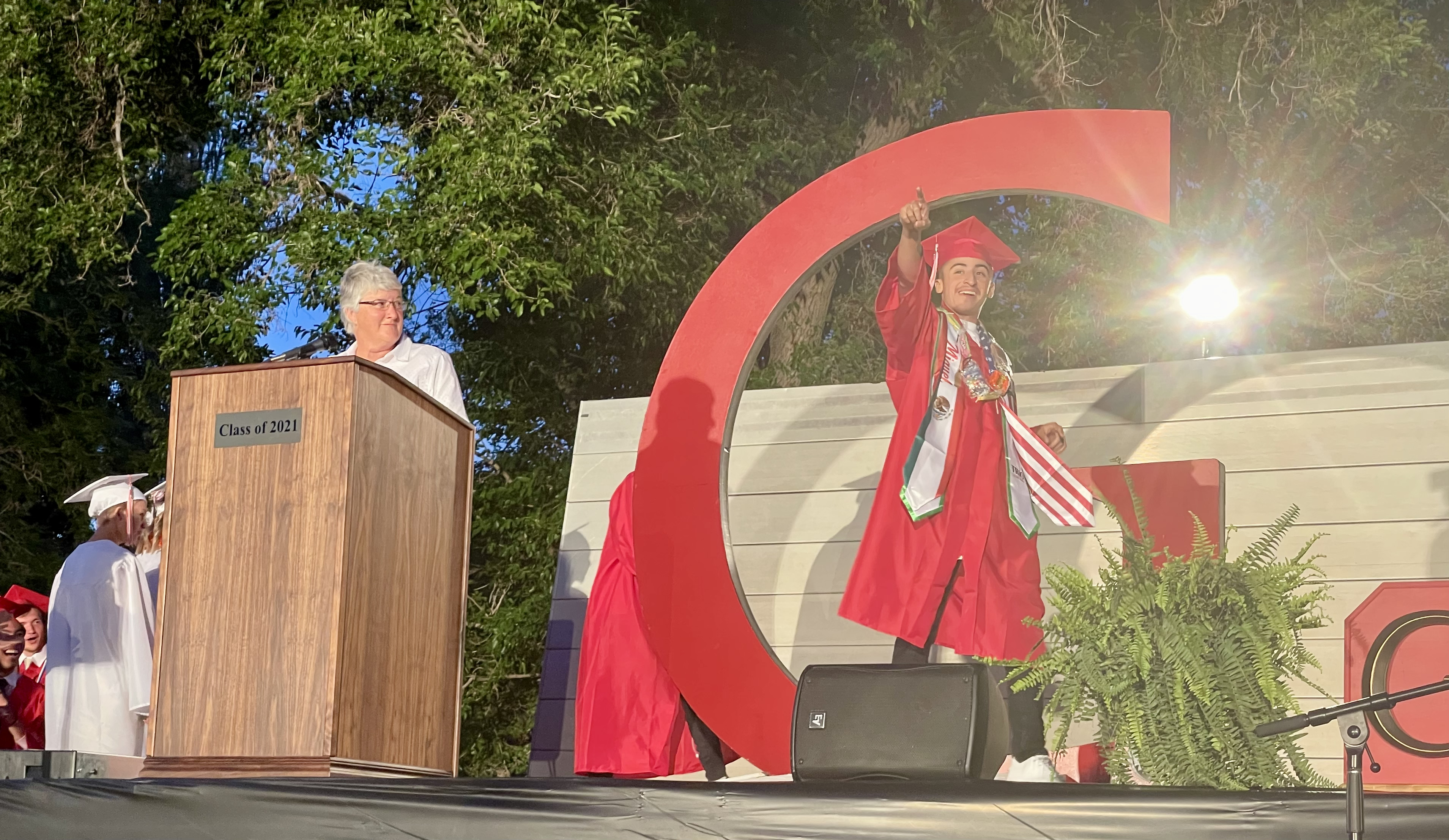 A dude walks through the big G during graduation. 